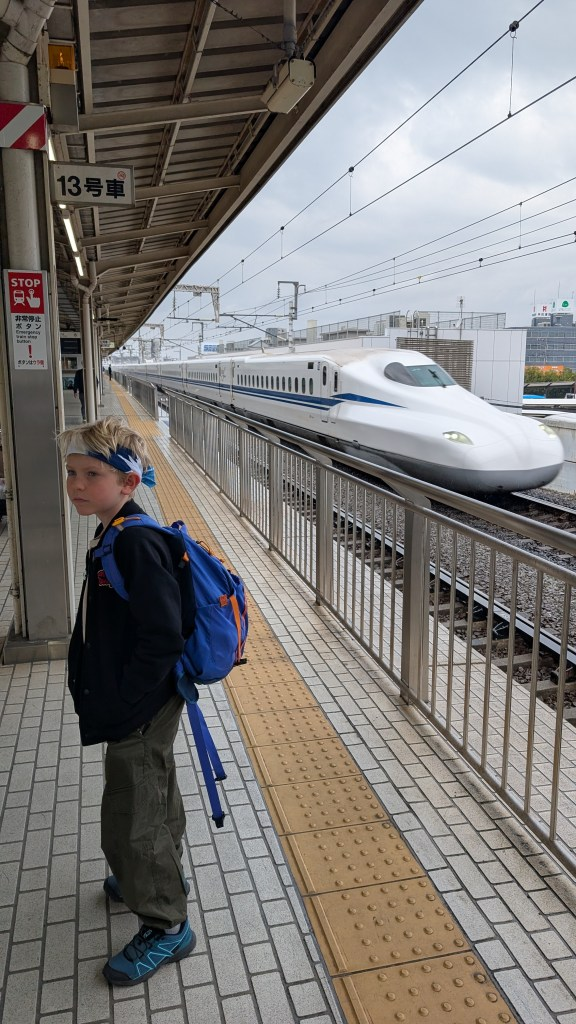 Shinkansen bullet train at a Japanese station platform
